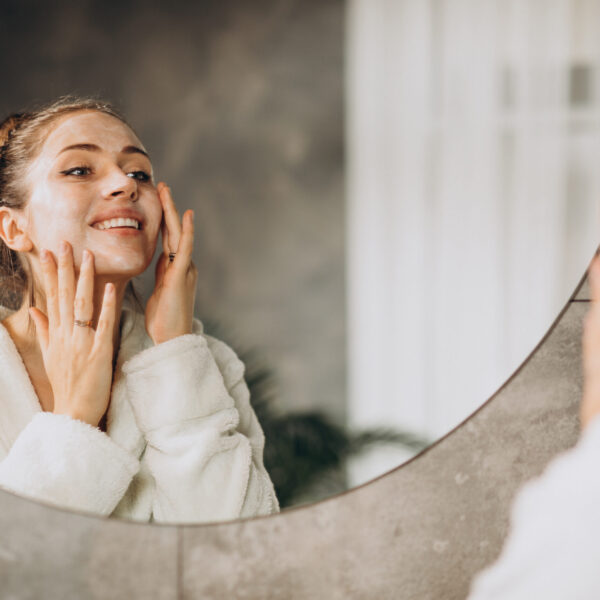 Woman,At,Home,Applying,Cream,Mask